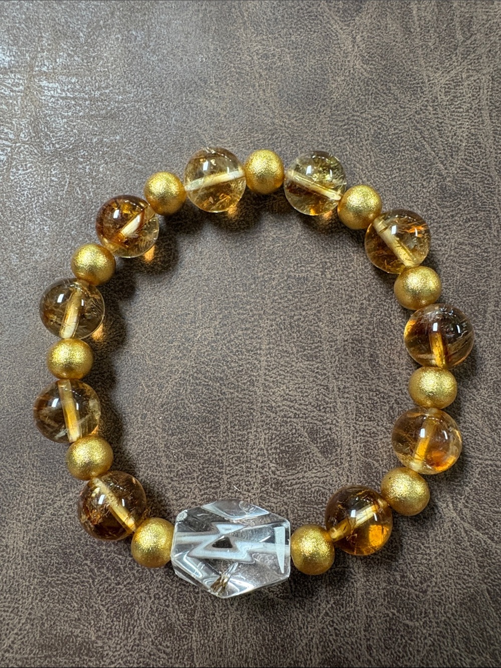 Citrine Bracelet with Gold Spacer Beads with a Quartz Accent stone.